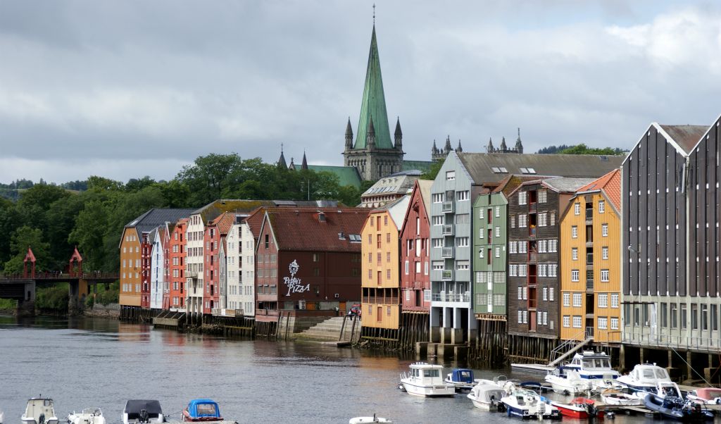 Wednesday – Arrived in Trondheim. This is a view of the colorful warehouses (for which Trondheim is apparently famous) on the Nidelva River, with the Nidaros cathedral in the background.