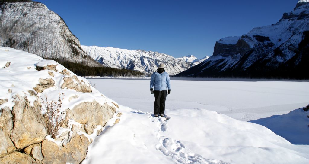 From Banff, it was a relatively short drive to Lake Minnewanka. This is a photo of Judith standing in front of the largely frozen lake.