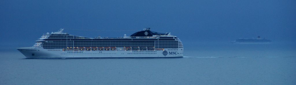 Later still, as it was starting to get dark, we passed two more cruise ships. The one in the foreground, the MSC Poesia, looks exactly the same as the MSC Orchestra we were berthed next to in Stavanger earlier.You can just make out another cruise ship on the horizon on the right, which appears to be exactly the same as the Arcadia look-a-like we passed a couple of hours ago.I had always assumed that cruise ships were fairly unique items, but it appears that somewhere there are cruise ship production lines churning them out like Ford Mondeos.