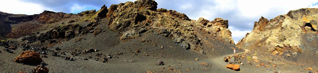 A panorama of the inside of the crater. You can just make me out on the path about three quarters of the way across.