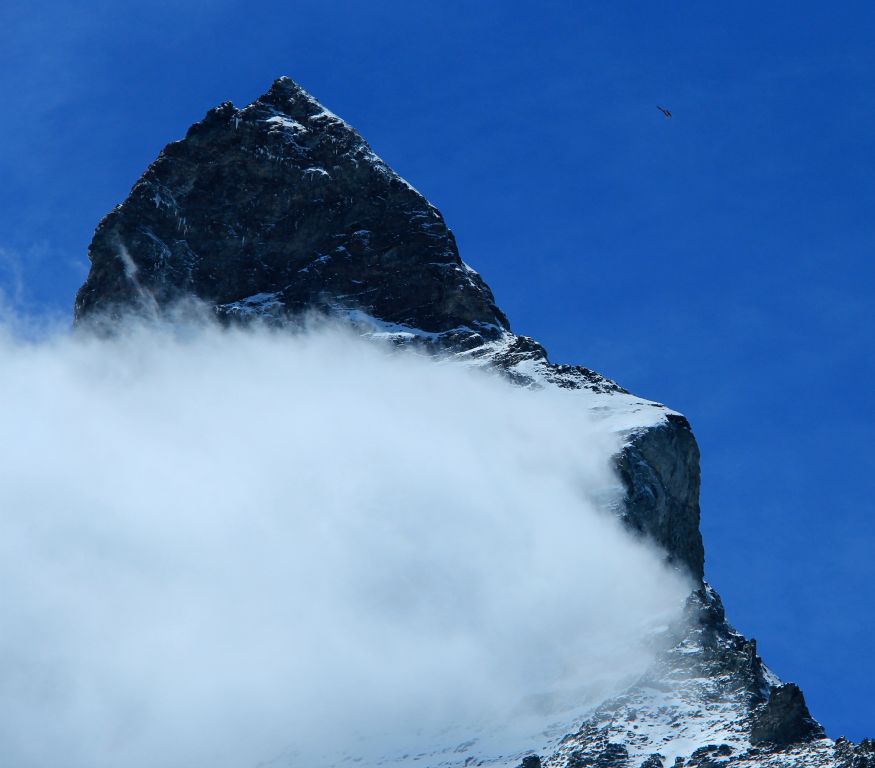 As I was walking, a sightseeing helicopter circled the top of the Matterhorn, giving a little bit of perspective as to how big the mountain is. You can just make it out towards the top right of the photo.