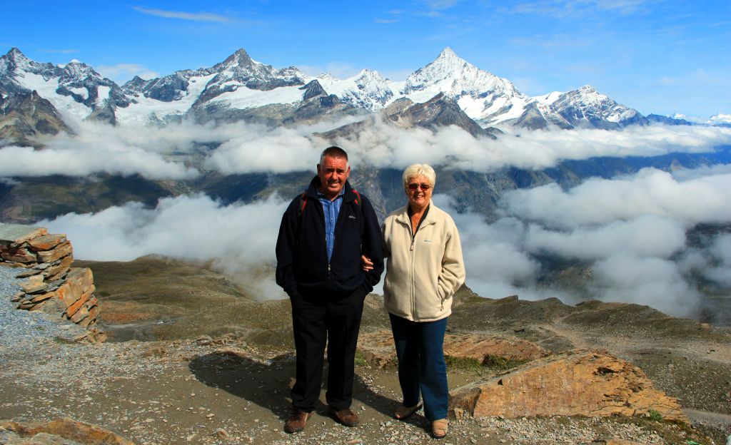 Parents with clouds and mountains.