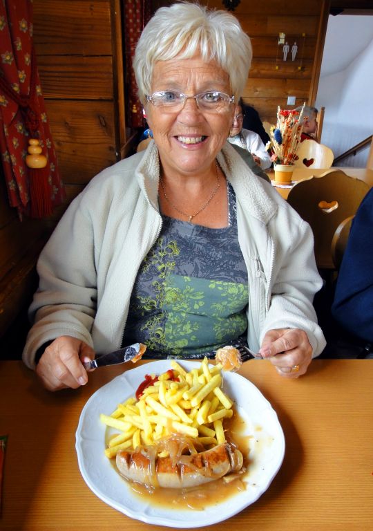 Having safely descended Oberrothorn, I met up with my parents for lunch at Sunnega. This is my mum tucking in to bratwurst with onion gravy and fries. Mmmmm.
