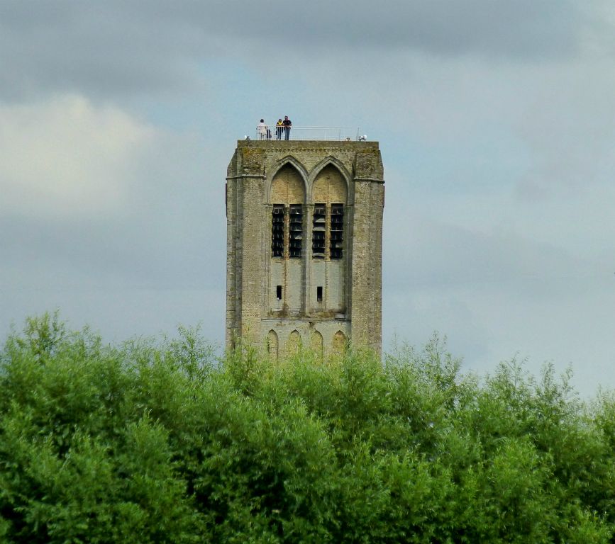 This is what the tower looks like from the canal. Although you can’t really appreciate its height fully as two thirds of it is obscured by the trees.