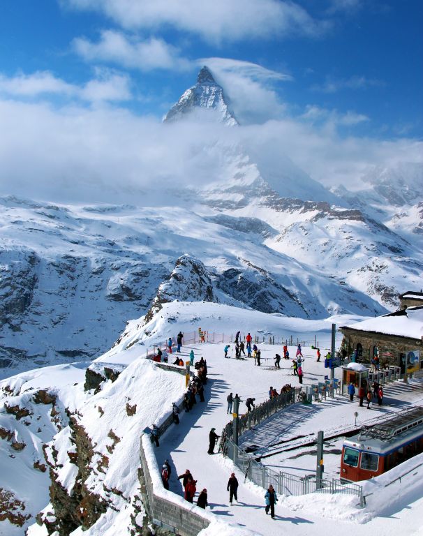 There weren't many people around at the hotel at Gornergrat, since most of the people on the train were skiers, who just got off the train, put on their skis and headed back down. Which was a shame (for them) because the views up here were magnificent.Here's a view of the train station, with the ever present Matterhorn just visible through the clouds.