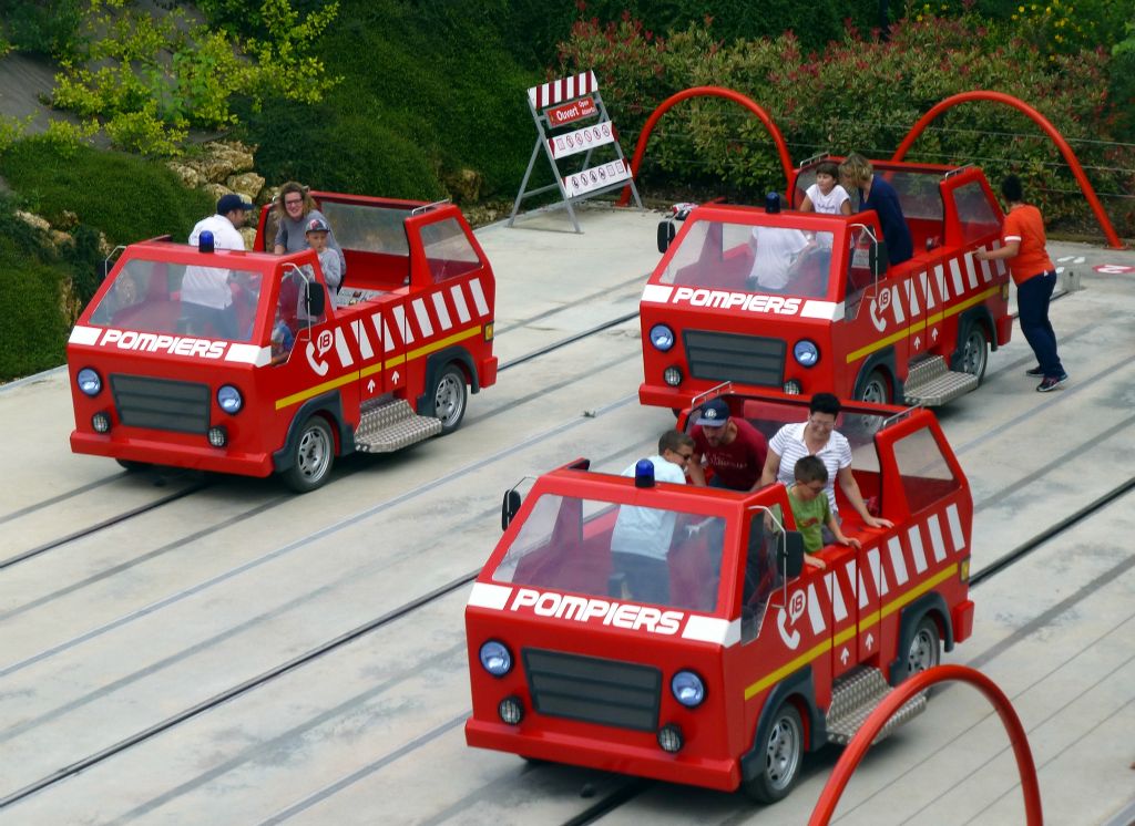 This looked pretty entertaining. Three teams of four people pump the handles in their little fire truck to race each other down the track...