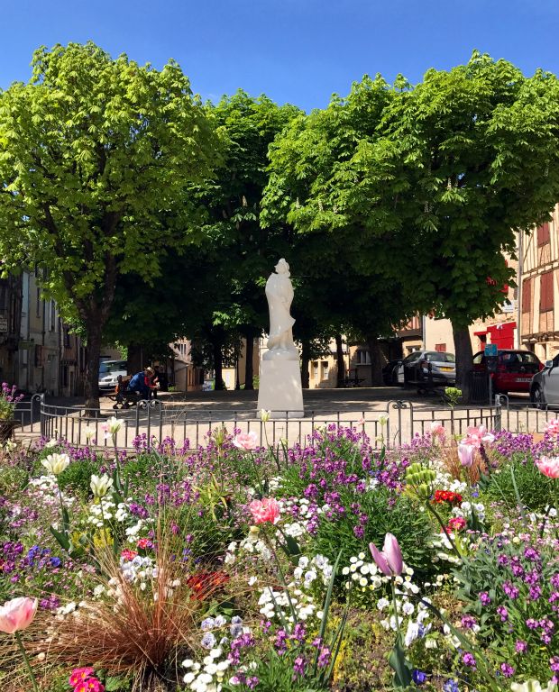 One of the town's statues of Cyrano de Bergerac in a pretty square.