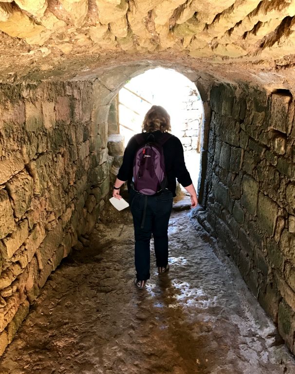 Judith walking through a tunnel.
