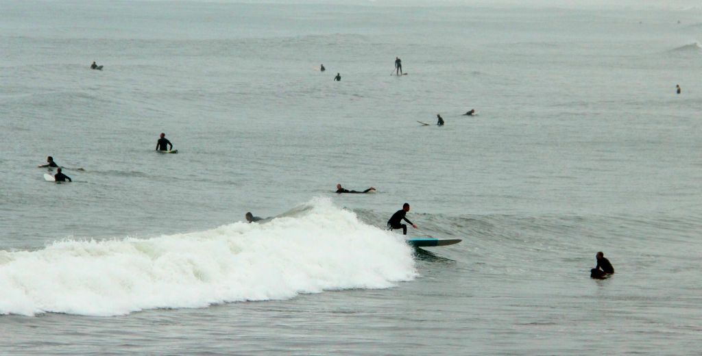 As you can see, there were a lot of surfers out. This one looks like he's about to mow down his pal on the right. With this many people in the water it seems likely there are regular incidents.