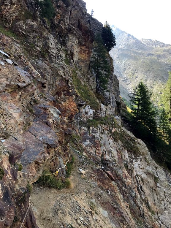 This is the most vertigo-inducing bit of trail I've walked on in the Zermatt area. The trail itself is barely visible below the rope bolted to the rock wall.
