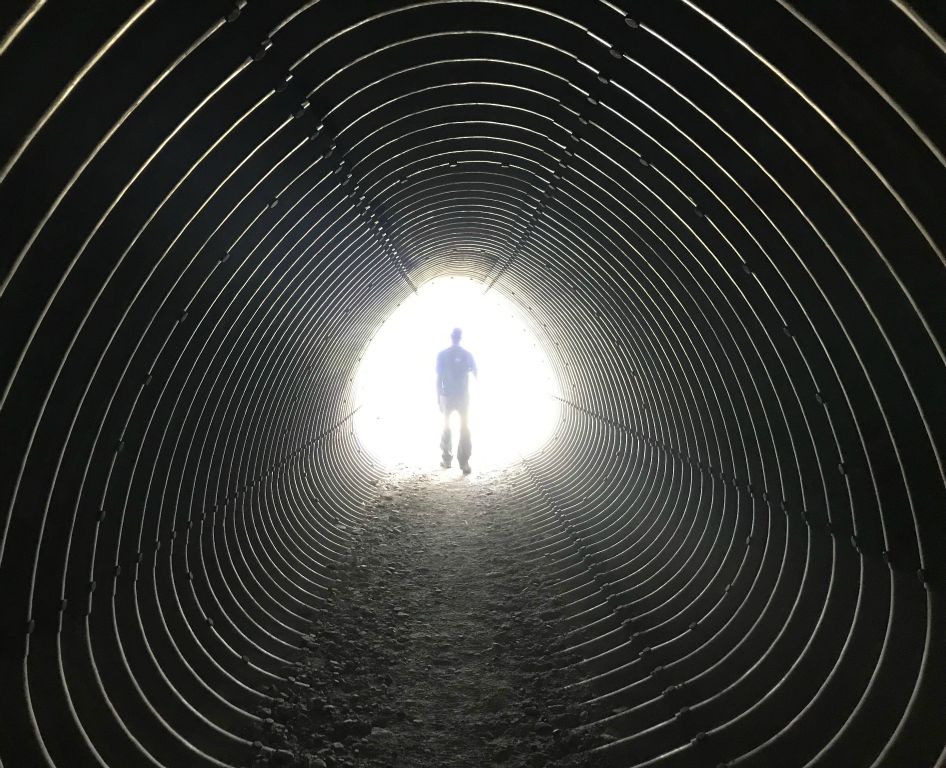 Even this bit of the trail occasionally ducked into tunnels. Here's Simon walking into the light.