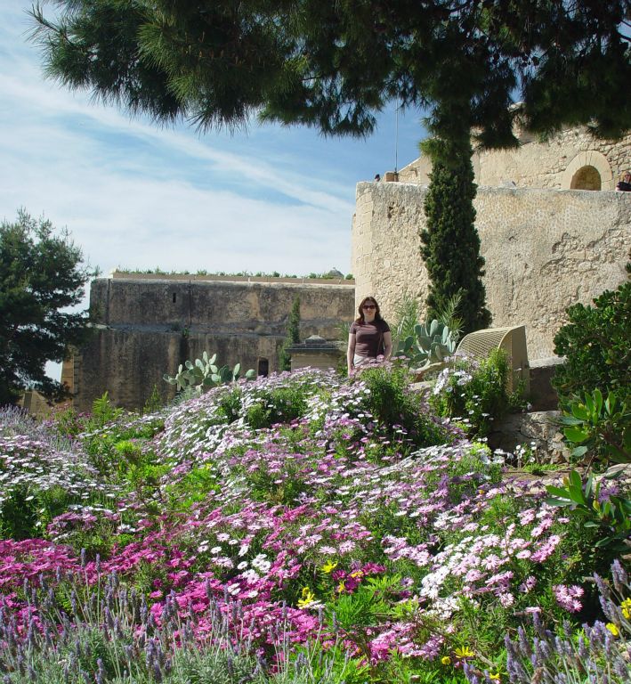 Judith and some flowers in the grounds of the Castillo de Santa Barbara.