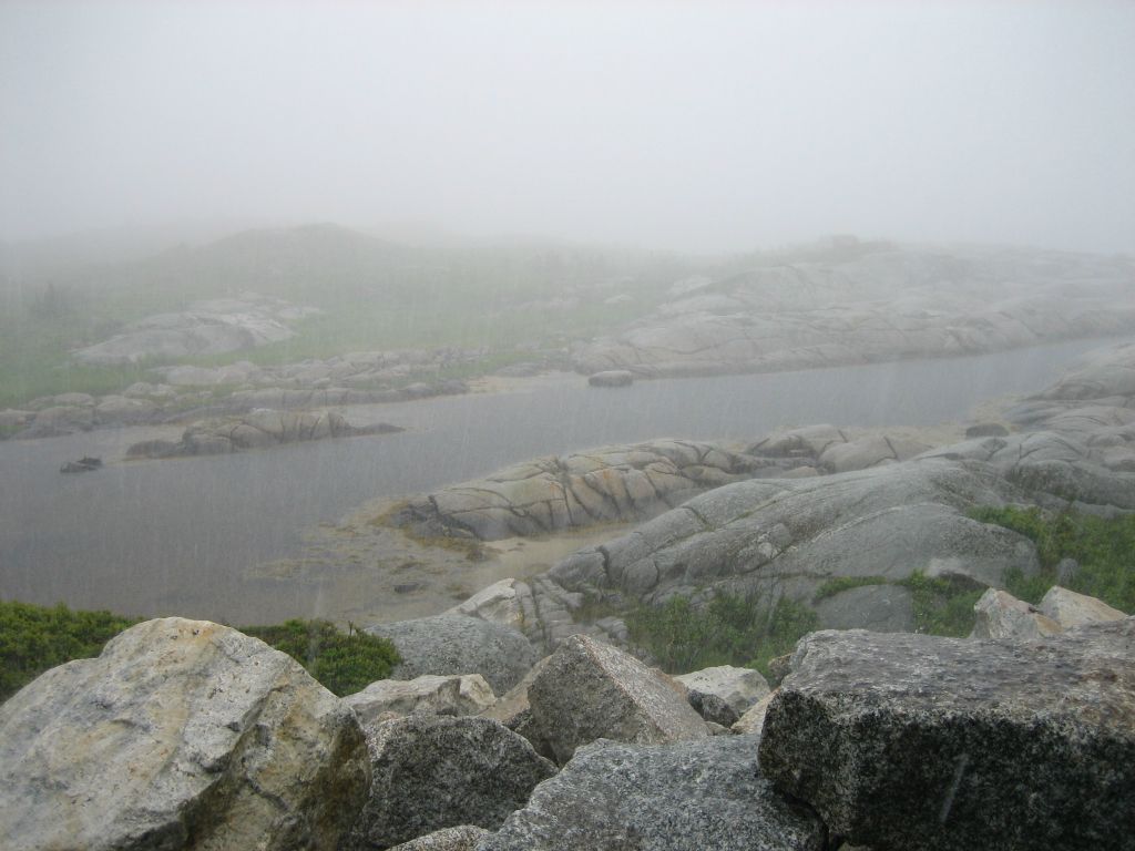As the weather was so bad, we thought we might as well leave Halifax immediately and begin the touring bit of the tour. The first scheduled stop was Peggy’s Cove, about 40 miles southwest of Halifax. Unfortunately this is what it looked like when we arrived. We decided to hang around for a bit, just in case the rain eased up enough for us to be able to at least get out of the car and have a bit of a walk about.
