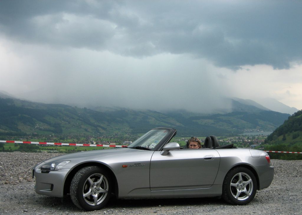 On Sunday we covered the final 400 miles from Luxembourg to Switzerland, through France and Germany. As we progressed south, the weather got progressively worse. This was taken as we were climbing into the Alps. About half-an-hour later we were driving though the torrential downpour that can be seen in the background. There was also a great deal of thunder and lightning. Very exciting.