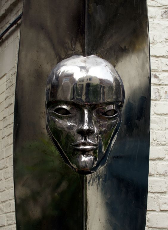 A sculpture of the Henri Maes man-in-the-moon logo in the courtyard outside the brewery.