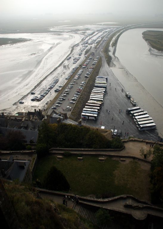This was the view from pretty close to the top, looking back along the causeway that connects Le Mont-Saint-Michel to the mainland. The highest bit will stay above the water (that's where the people staying in the hotels on Le Mont-Saint-Michel park). The rest, which is where I was parked, get submerged by each high tide.We continued the tour for a couple more hours, then had a very nice, albeit rather cramped and hectic, lunch in one of the restaurants in the lower town before we continued our journey east towards Normandy.