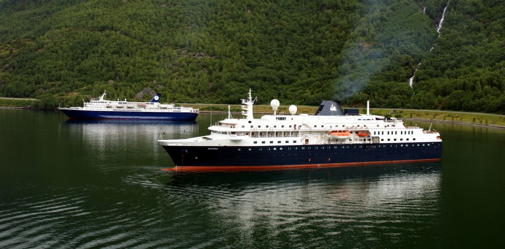 While we'd been away, the small cruise ships CMV Ocean Countess and the Swan Minerva had arrived. As Arcadia had occupied the only berth in Flam, they'd dropped anchor in the middle of the fjord and were ferrying their passengers to shore using their tenders.