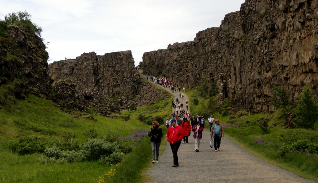 Our first stop was Thingvellir, which is the site of the original Icelandic Viking parliament from, oooh, ages ago. Now it’s a UNESCO World Heritage site. It's also apparently the only place above sea level that you can see the meeting point (or, more accurately, parting point) of the North American and European continental plates.The rocks on the left of the path are part of the North American plate and the rocks on the right of the path are part of the European plate. To my mind, this makes the actual path itself really quite a dangerous place indeed to loiter about.Being Iceland, there were probably hardly any people here most of the time. However, there are so many people in this photo because Thingvellir was the first stop for all of the tours leaving Arcadia, so a few hundred people all turned up at more or less the same time.Note to self - must come back here independently.