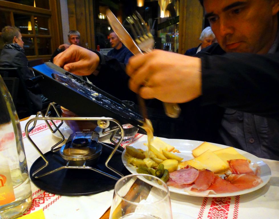At dinner in the evening I opted to try the alleged local speciality "raclette". However, I was not entirely convinced this wasn't some sort of tourist gimmick and the waiting staff stand just out of sight laughing at the stupid tourist. The "raclette" is a hinged plate that lays flat over a flame on which you can "cook", i.e. melt, the cheese supplied with your meal. Once the cheese is molten, you can tip the cooking plate, as I'm doing in the picture, to deposit the cheese on your plate. Given that I don't mind eating solid cheese, the whole exercise seemed a bit pointless. But there you go. When in Chamonix, do as the Chamonixians do. Allegedly.While we were having dinner, there was a massive thunderstorm that caused all of the street lights to go out for about 15 minutes. Very exciting.
