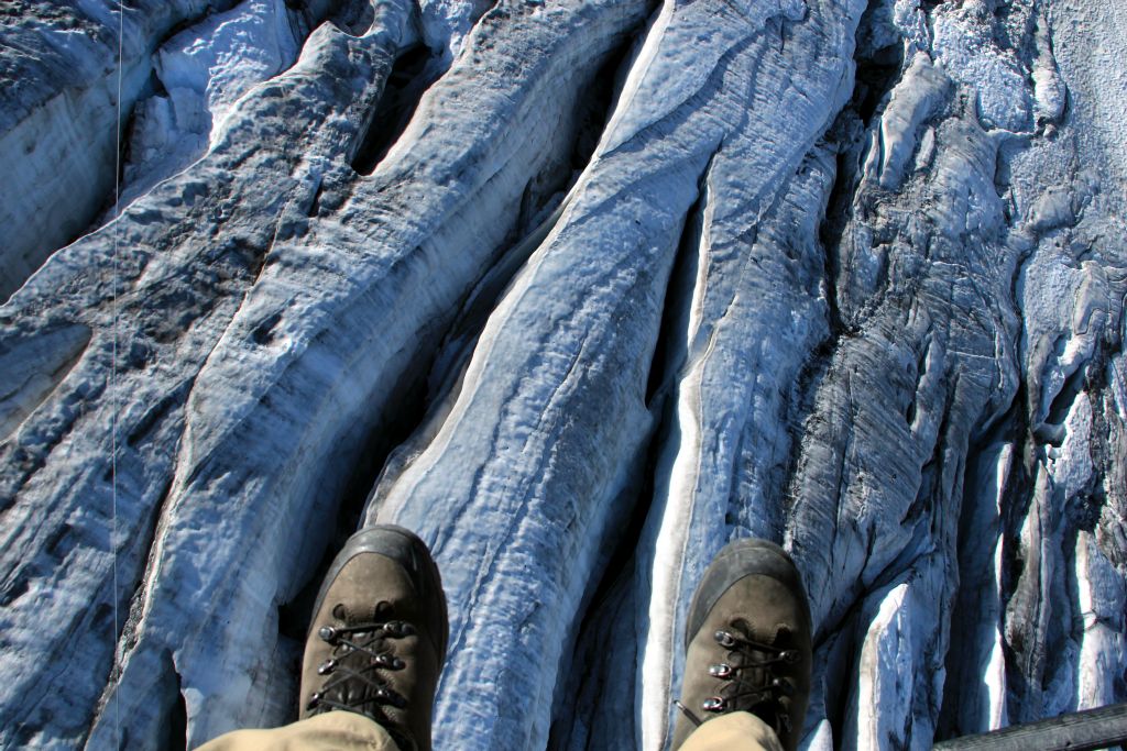 This looks like a photo of my feet standing on the ice, but it's actually a photo of the chasms in the glacier some 60 feet below my dangling feet. Exciting.