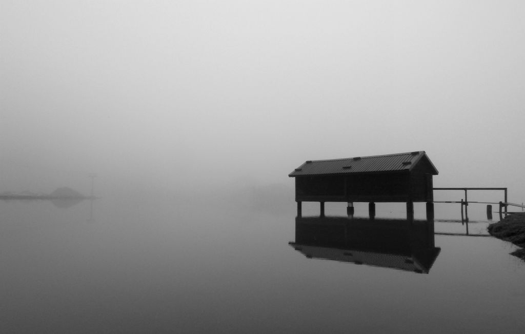 At the lake, visibility was no better, so I spent a bit of time walking around the lake taking photos. This is a photo of the boathouse.