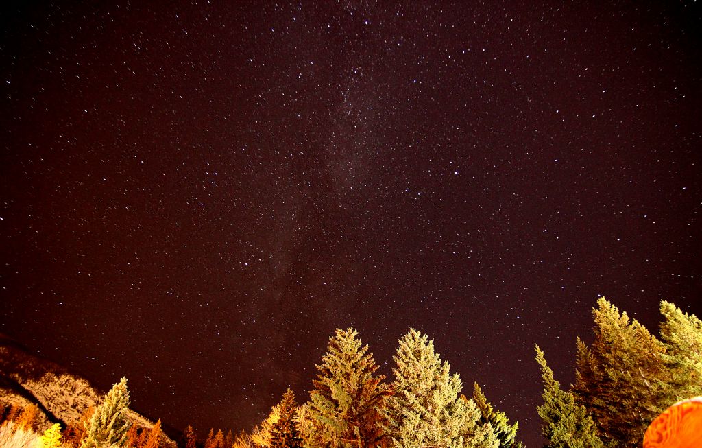 This was taken in the garden in front of the town hall in the middle of Banff using a 30 second shutter, which is why the trees in the foreground are so very illuminated. It is presumably testimony to the clarity of their air that there's no orange glow washing out the sky and hiding the stars.