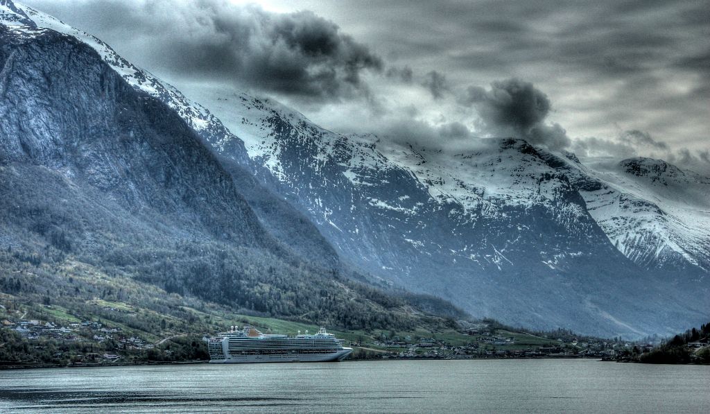On the way back to Azura, we stopped on the opposite side of the fjord for a photo opportunity. The colours are a bit washed out as I was taking the photo into the sun. Still, despite the washed out colours, it gives a bit of scale to the scenery.