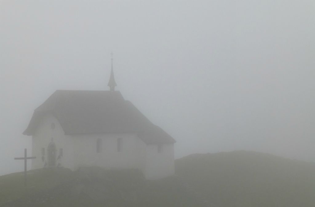 Wednesday - The view of the church is somewhat obscured this morning and it’s raining fairly heavily. We walk the couple of hundred meters to the cablecar station and travel down to recover our car for the drive to Arosa.