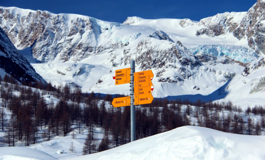 I hung around for a while taking photos, my favourite of which was this one of a snow-buried signpost. On the right hand side, just above the level of the signpost, you can just make out the blue of the ice in the Zmuttgletscher (thanks to Judith for pointing that out - I'd not even spotted it!).