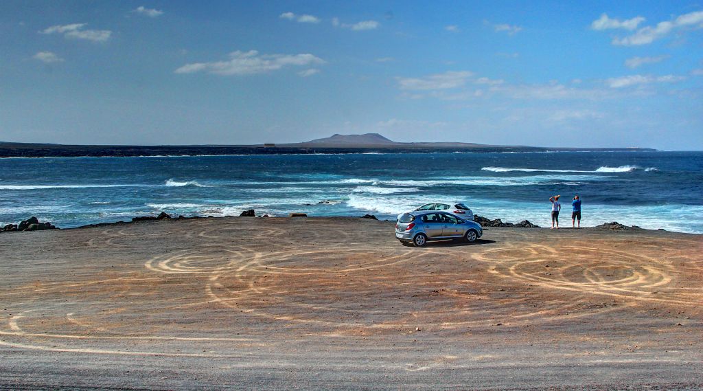 Just up the road from the Salinas de Janubio I found a large, deserted car park that offered an excellent opportunity to take a photo of the car with some crashing waves in the background. So I parked up and walked fifty meters across the car park to make sure I could get plenty of scenery in. Just as I was lining up my shot, a Corsa crept into my field of view, drove slowly across my field of view and then parked absolutely directly right in front of my car, as seen above. Unbelievable. They couldn’t have blocked my view more comprehensively if I’d put cones out and a sign that said “park here to completely block my view”.