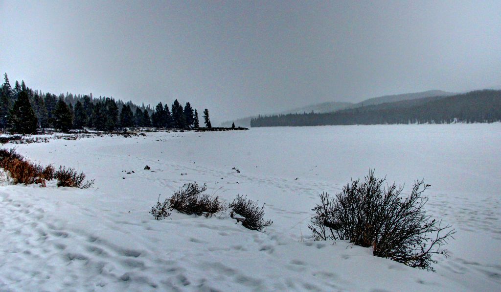 Eventually we made it to Maligne Lake, which, as you can see, was pretty snowy.On the 45 minute drive to the lake we had seen two cars, one snow plough and, remarkably, a bloke on a bicycle! On the 45 minute drive back to the hotel we saw no vehicles at all and one elk, which we nearly ran over because it was standing in the middle of the road at the bottom of a hill. I was only doing about 35-40mph when I saw the elk a couple of hundred yards away, but I’d only managed to slow the car down by about 15mph by the time we’d reached the spot the elk would have been standing in if it hadn’t conveniently stepped off the road a few seconds earlier.