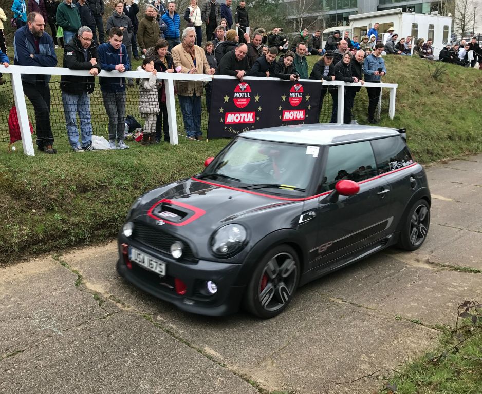 Everyone was invited to take their Mini up the Brooklands Test Hill, which is a lot steeper than it looks. The first third is 1:8, the middle third is 1:5 and the top third is 1:4. But I think the hardest bit of driving up it is probably that the "road" surface is really broken and uneven. The more powerful cars were bouncing all over and really scrambling for grip.My photo hasn't really captured the drama and speed. So maybe phone cameras do have some limitations after all.