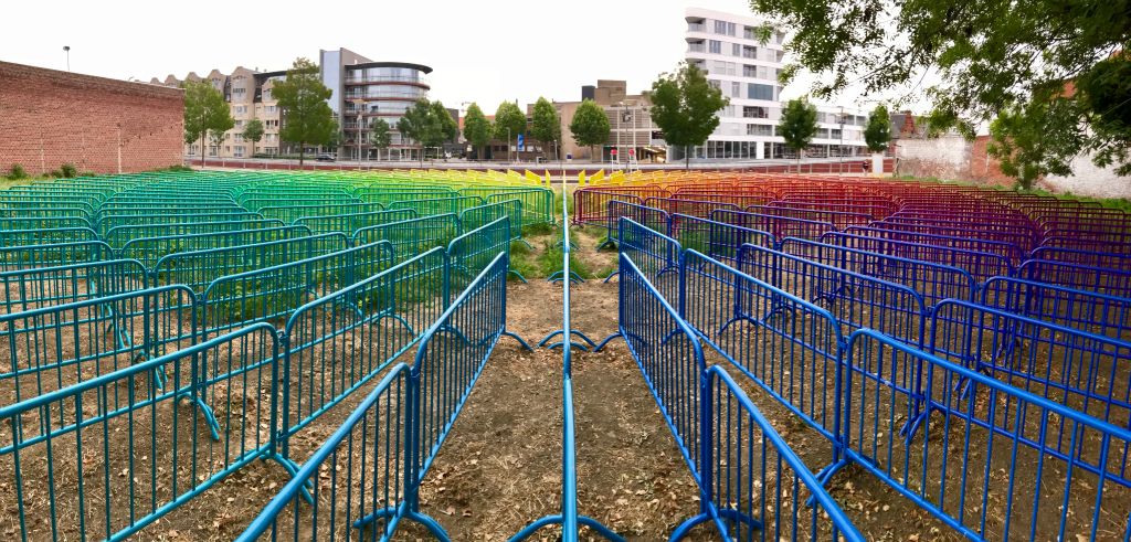 It's basically just a load of pedestrian barriers painted in a rainbow of colours.[This was taken with the Panorama setting of my phone's default Camera app.]
