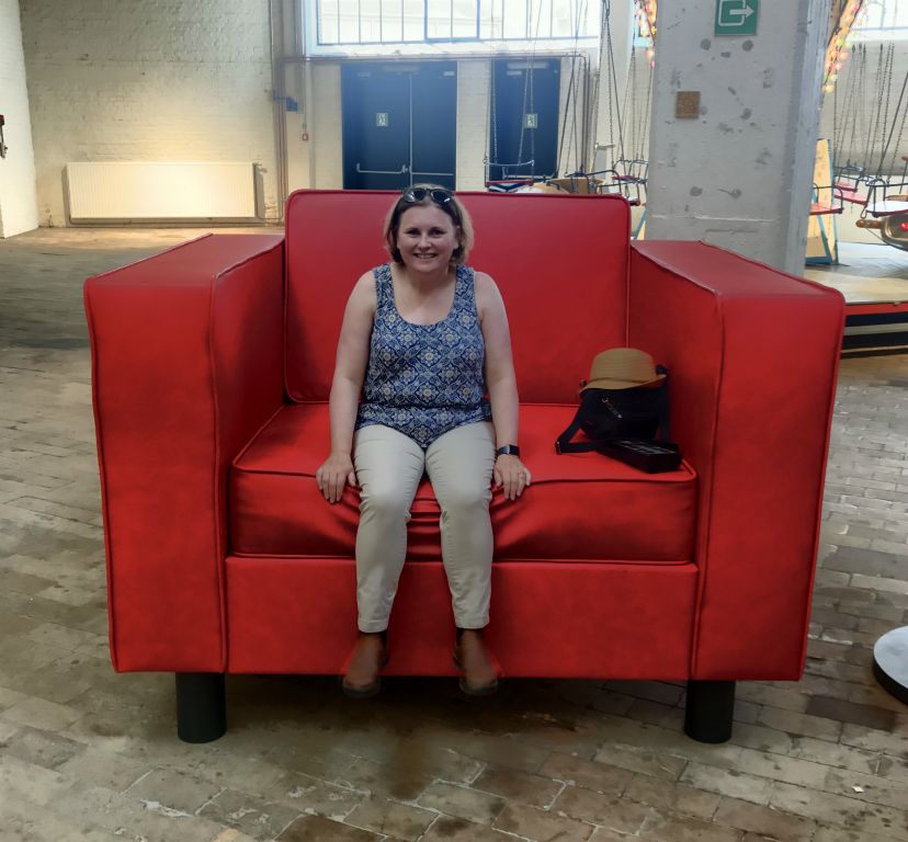 Judith in a giant armchair artwork. There was also a carousel that turns more slowly than normal to demonstrate the futility of time and space, or some garbage like that. I hate modern "art". At least you could sit on the massive chair.
