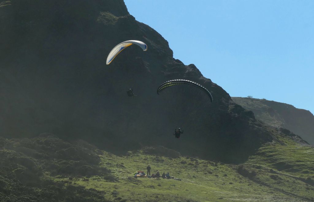 There were quite a few paragliders around. They certainly had the wind for that sort of thing. Again, a tricky photo almost directly into the sun, which is why the colours look a bit washed out.