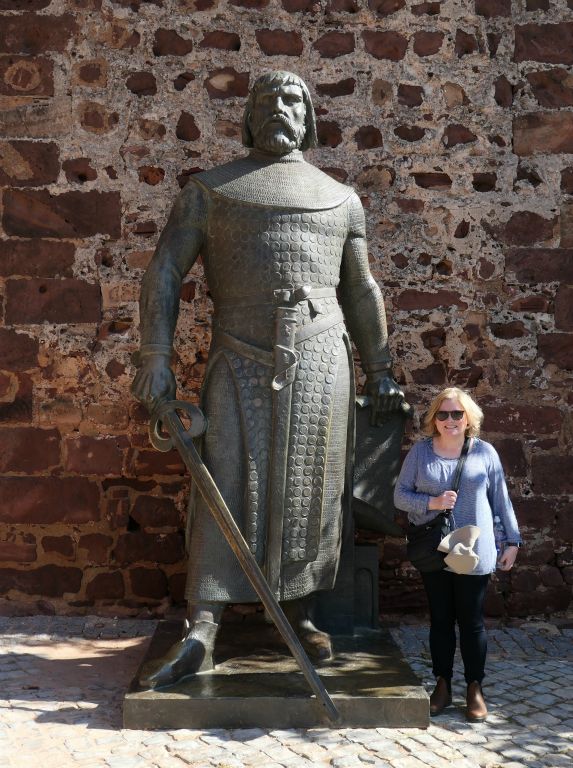Judith with a massive statue of a knight outside the castle. I can't remember who he is/was.