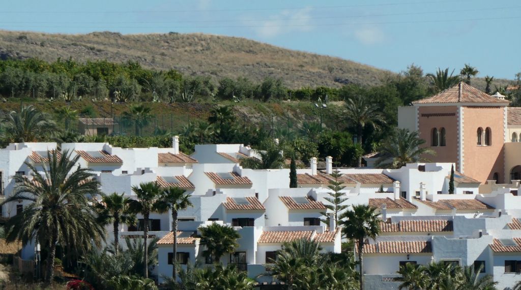 Approaching the resort, I could (just) see Judith on our roof terrace. Can you see her right in the middle of this photo?