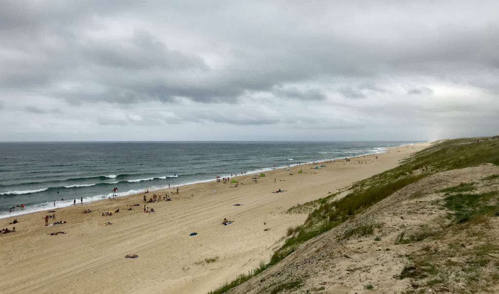 Despite the fact that it was cool (about 21C) and cloudy, there were plenty of people on the beach. This place must be rammed on an August weekend.This was the view looking north.